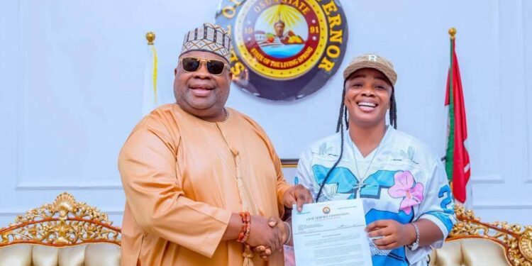 Governor Adeleke presents appointment letter to Oluwatosin Adejumo, the puff-puff seller who went viral.