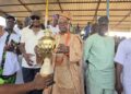 A large crowd gathers as Open Salawu celebrates his birthday with a football competition and cash prizes for 100 natives in Ogbomoso.