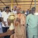 A large crowd gathers as Open Salawu celebrates his birthday with a football competition and cash prizes for 100 natives in Ogbomoso.